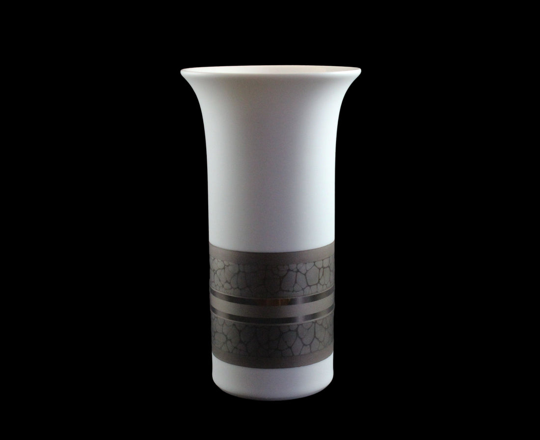 White porcelain Rosenthal vase with platinum and gold embellishments.