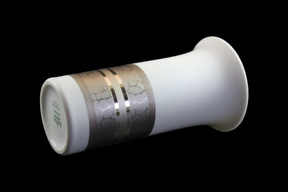 White porcelain Rosenthal vase with platinum and gold embellishments.