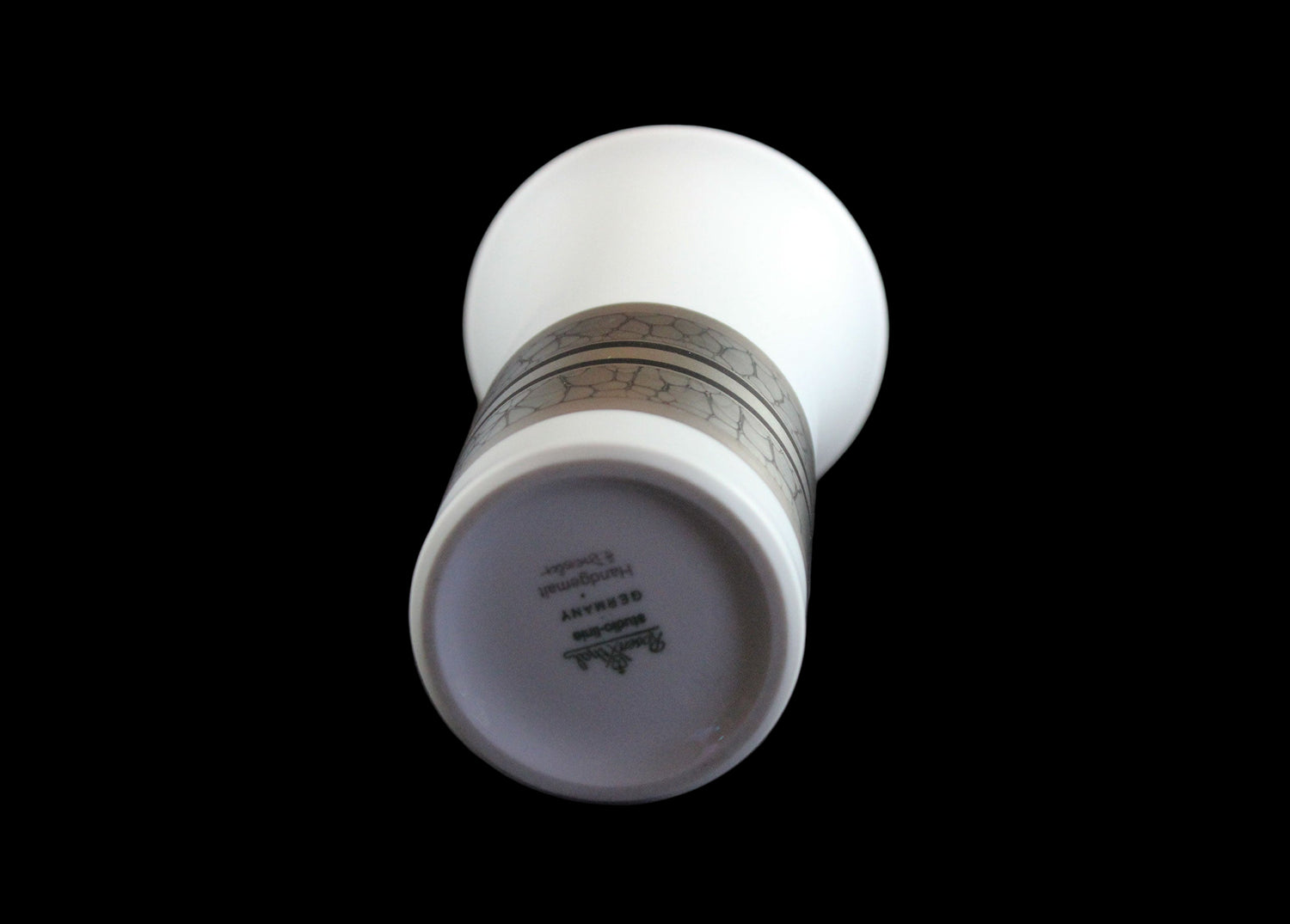 White porcelain Rosenthal vase with platinum and gold embellishments.