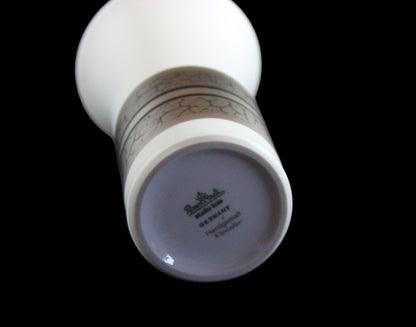 White porcelain Rosenthal vase with platinum and gold embellishments.