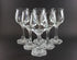 Set of clear wine glasses on a black background