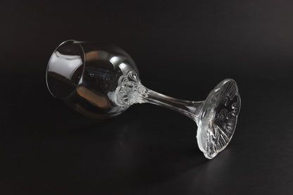 Rosenthal wine glass with intricate design on a black background