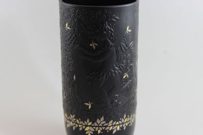 Black vase with gold floral patterns on a white background