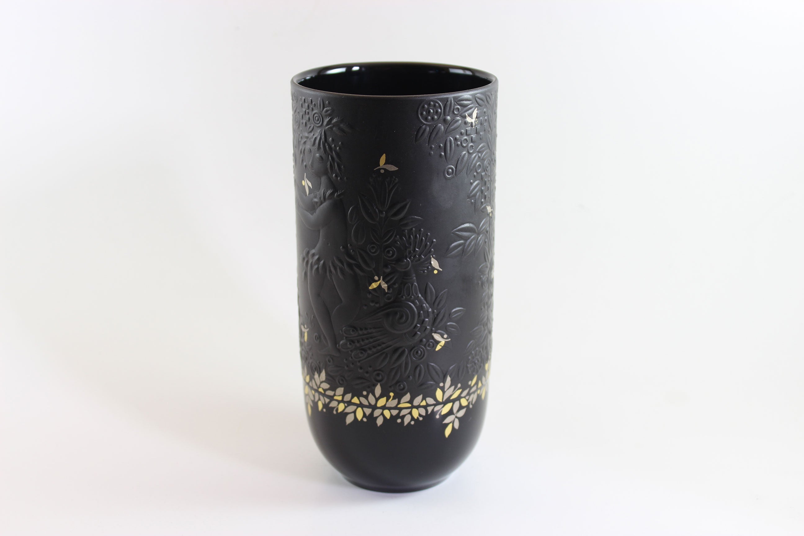 Black vase with gold embossed design on a white background