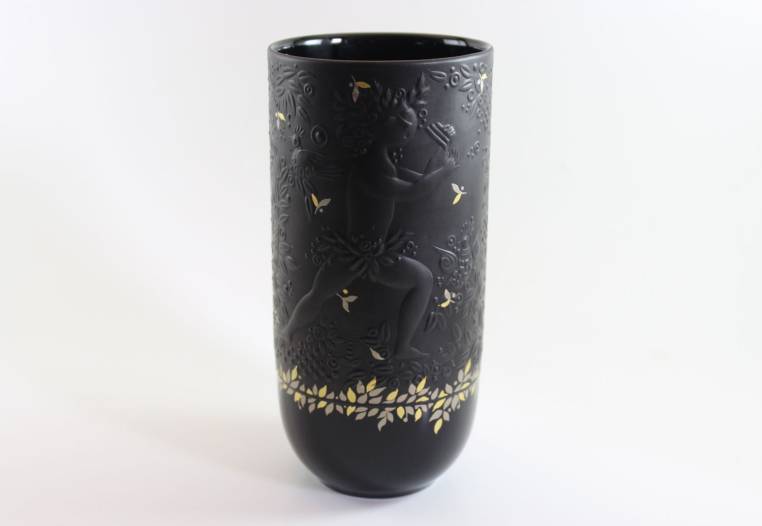 Black vase with gold embossed design on a white background