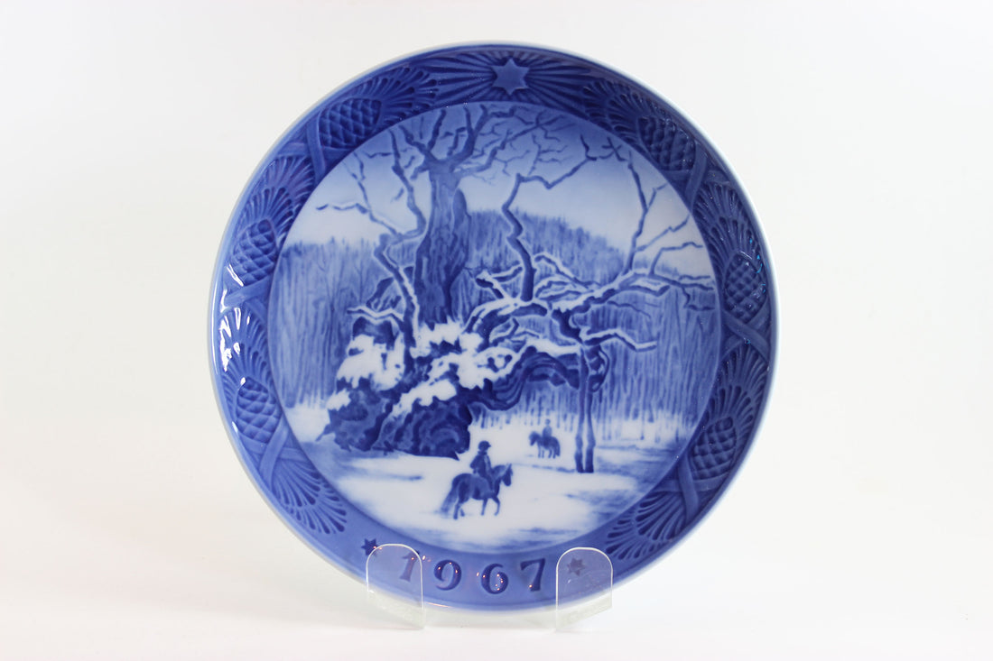 Blue and white decorative plate with a winter scene and &
