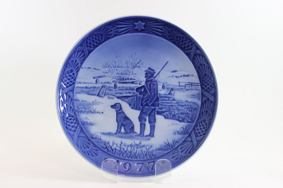 Hunter with rifle and dog in winter at Immervad Bridge.