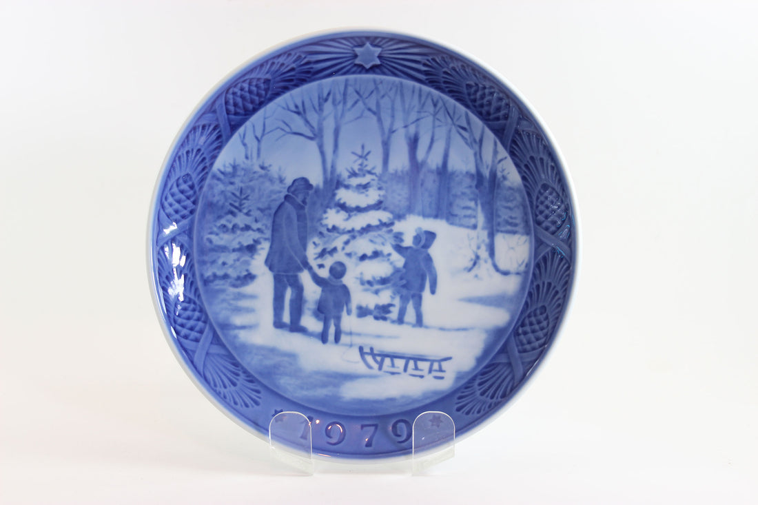 Blue and white decorative plate with winter scene and &