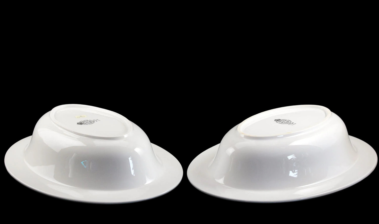 Two Royal Worcester Bridal Rose oval bowls with blue grey band and silver rims on a black background