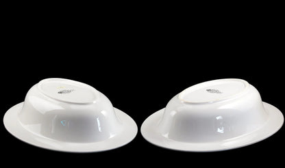 Two Royal Worcester Bridal Rose oval bowls with blue grey band and silver rims on a black background