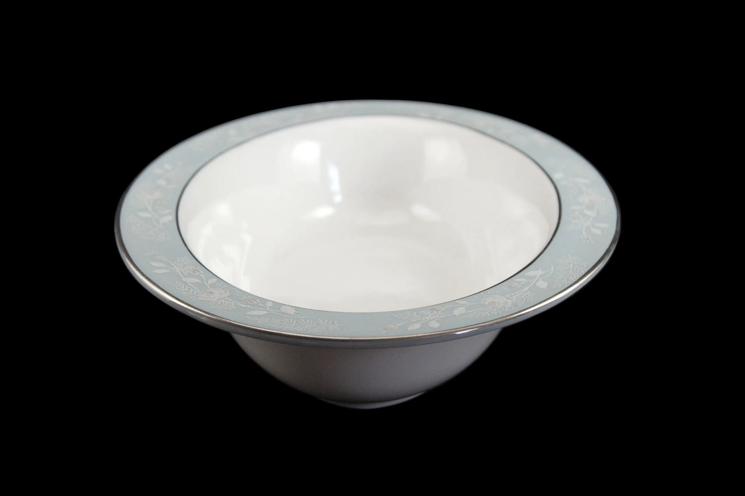 Royal Worcester Bridal Rose oval bowl with blue grey band and silver rims on a black background