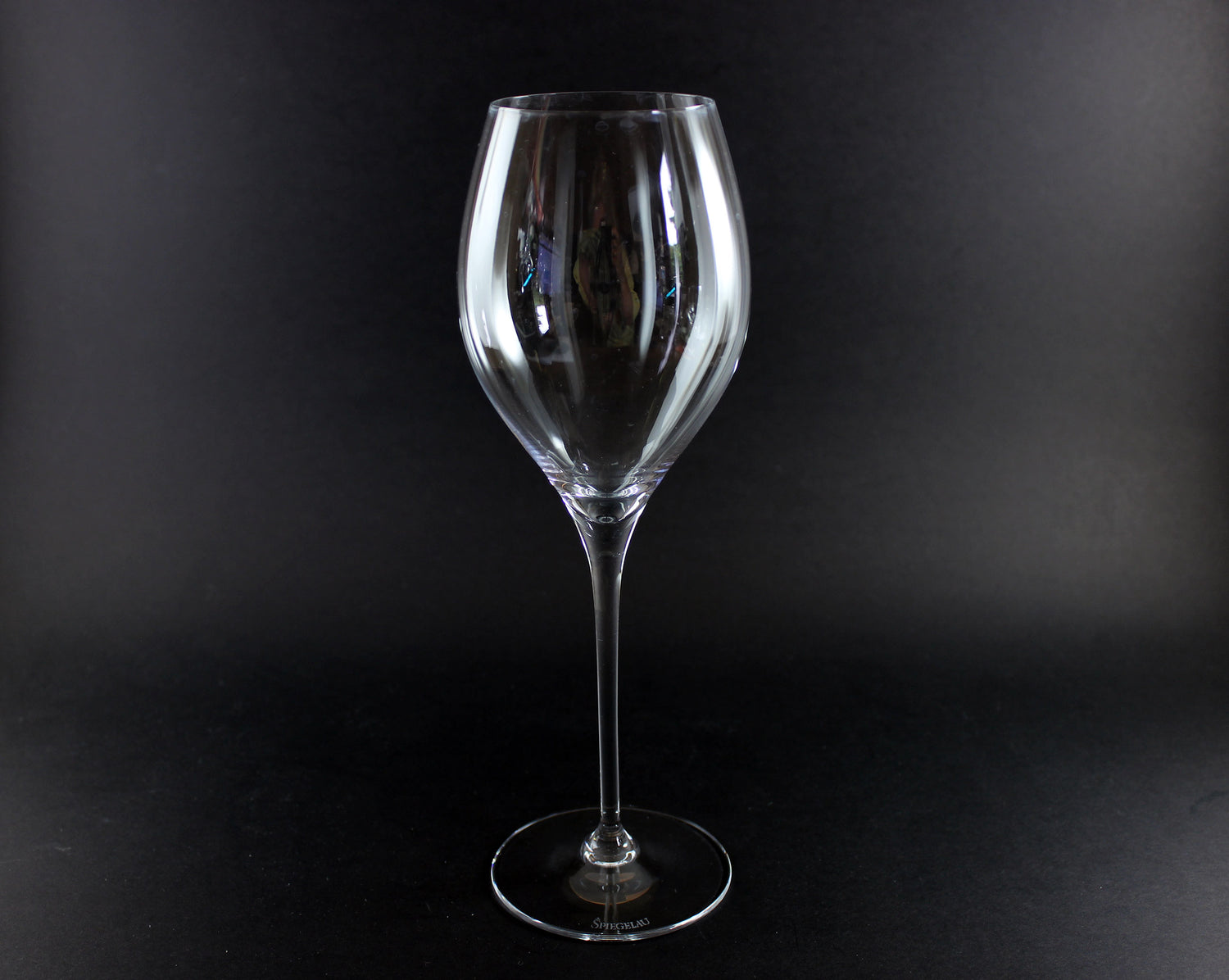 Clear wine glass on a black background
