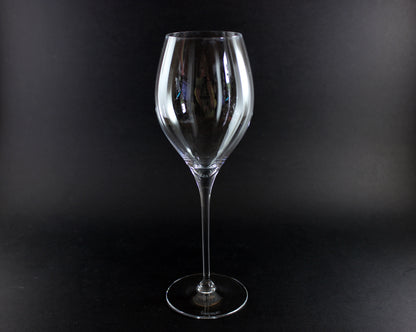 Clear wine glass on a black background