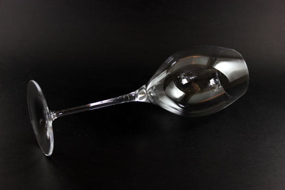 Clear wine glass on a black background