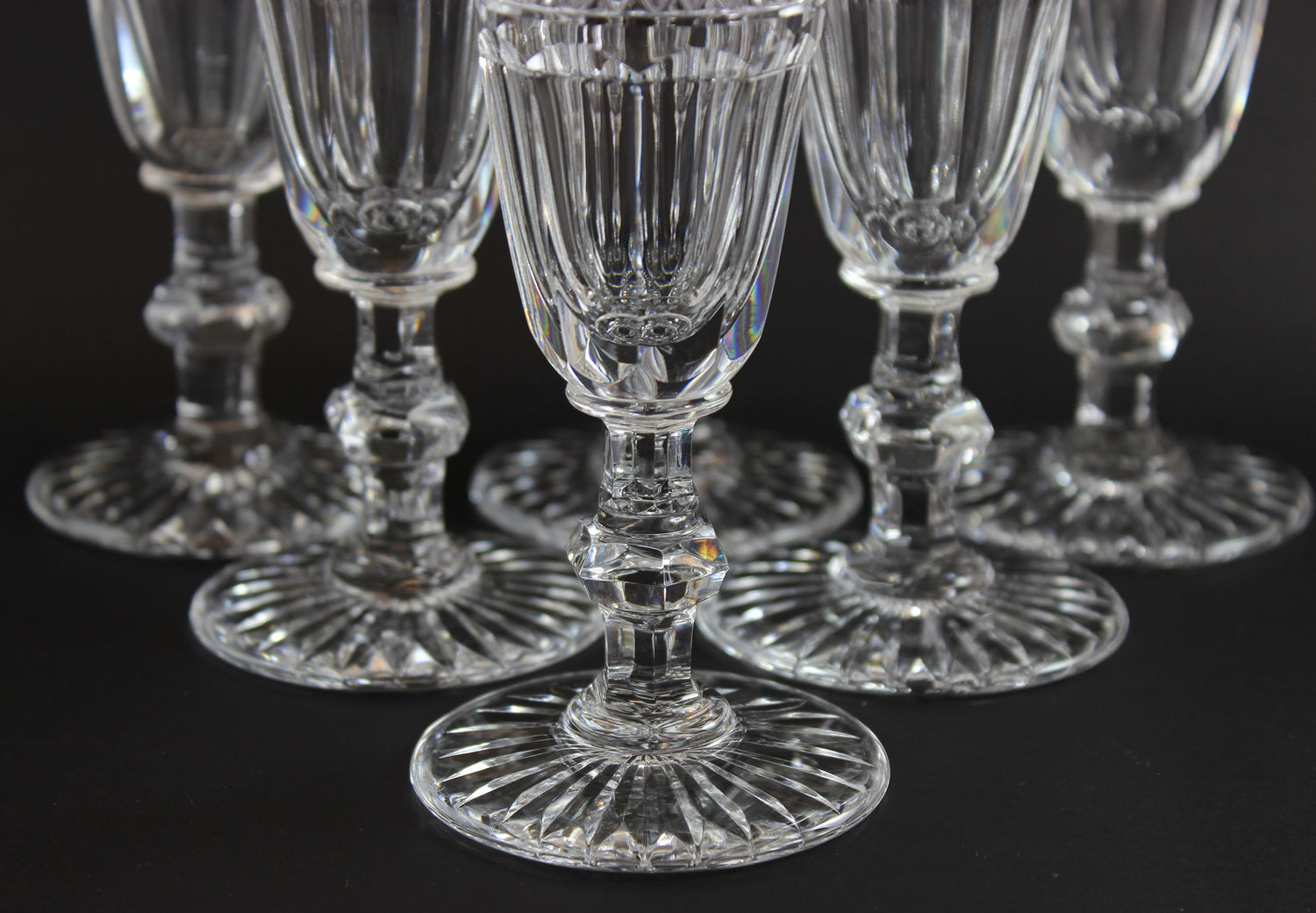Set of crystal wine glasses on a black background