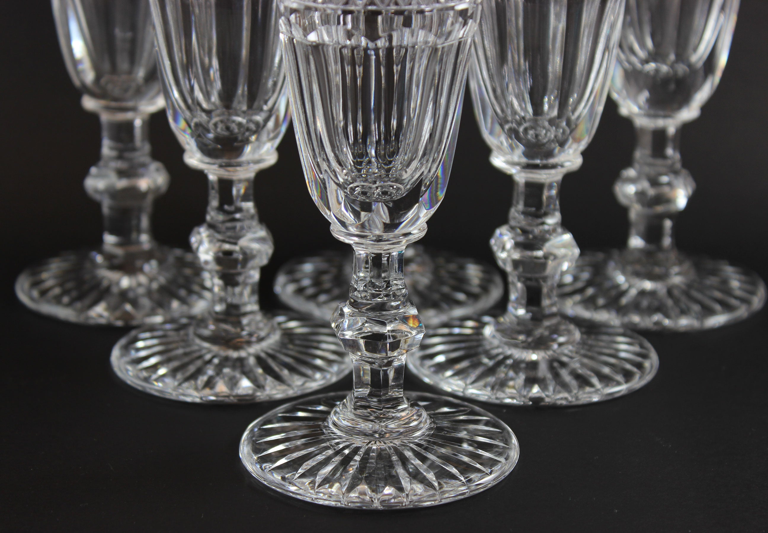 Set of crystal wine glasses on a black background