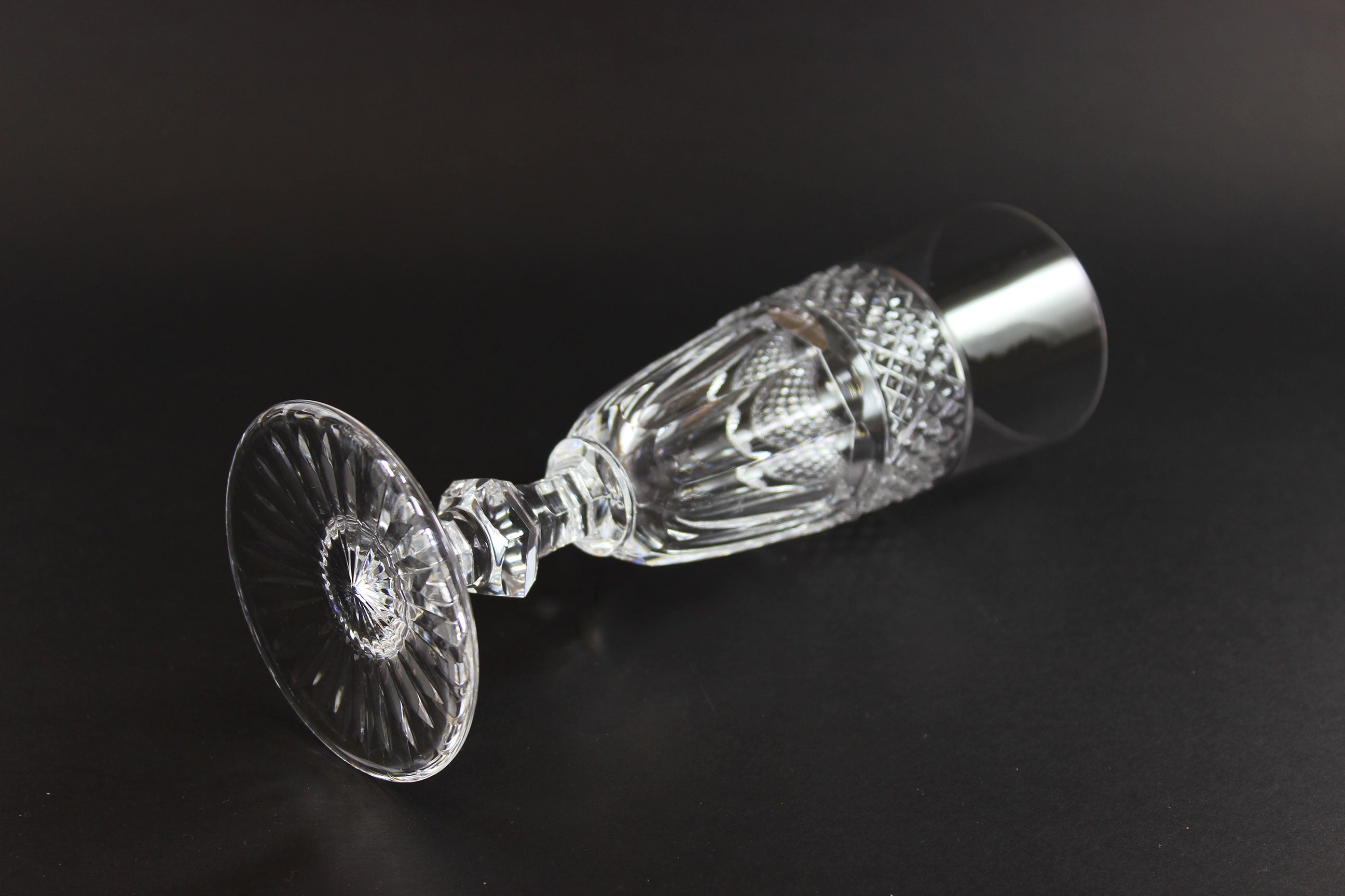 Clear crystal Champagne flute on a black background