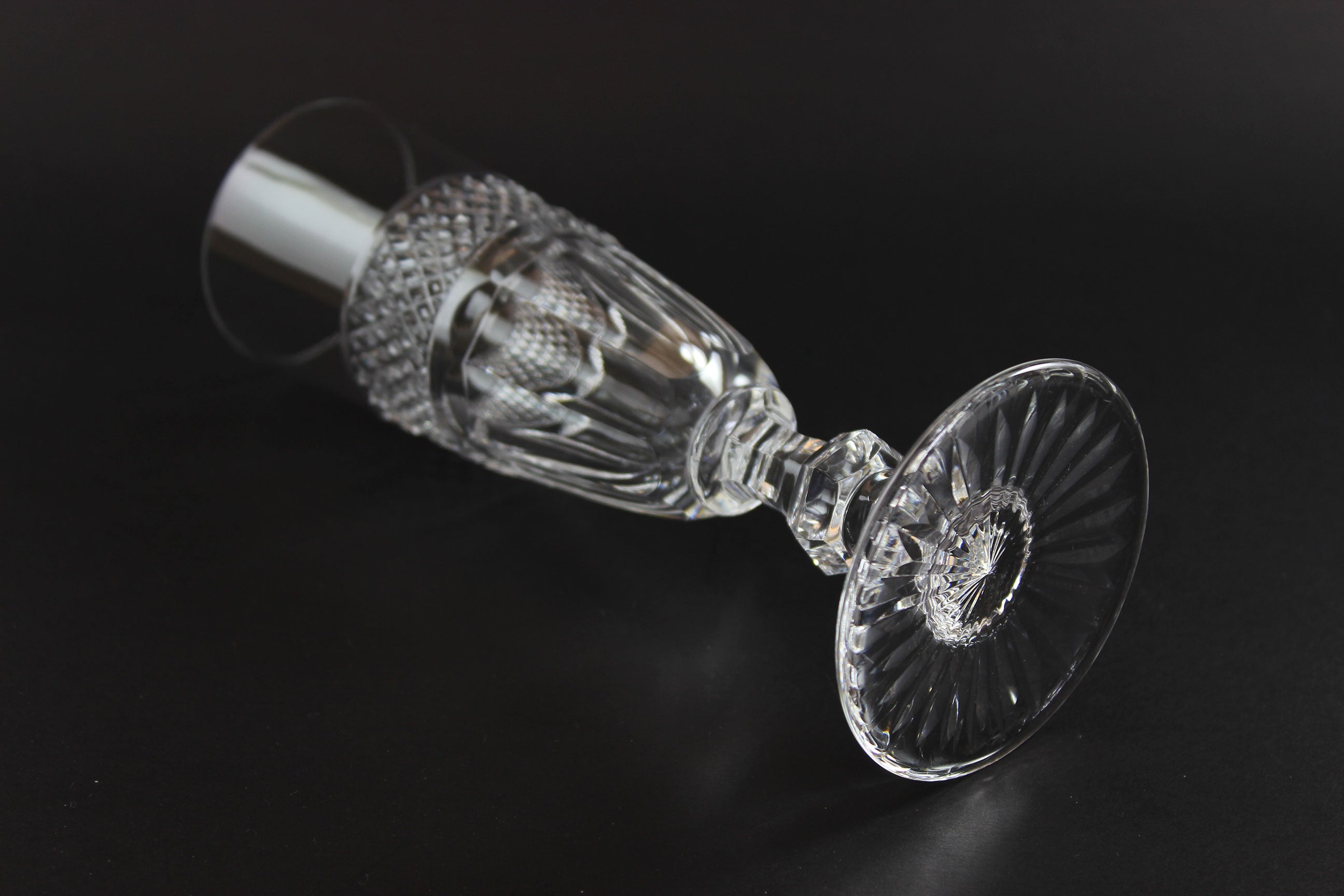 Clear crystal Champagne flute on a black background