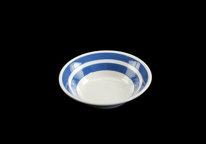 White ironstone cereal bowl with blue stripes in Cornishware style.