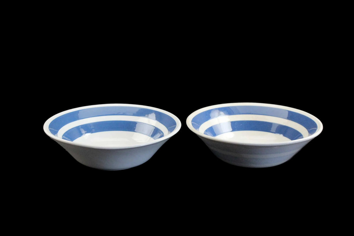 White ironstone cereal bowl with blue stripes in Cornishware style.