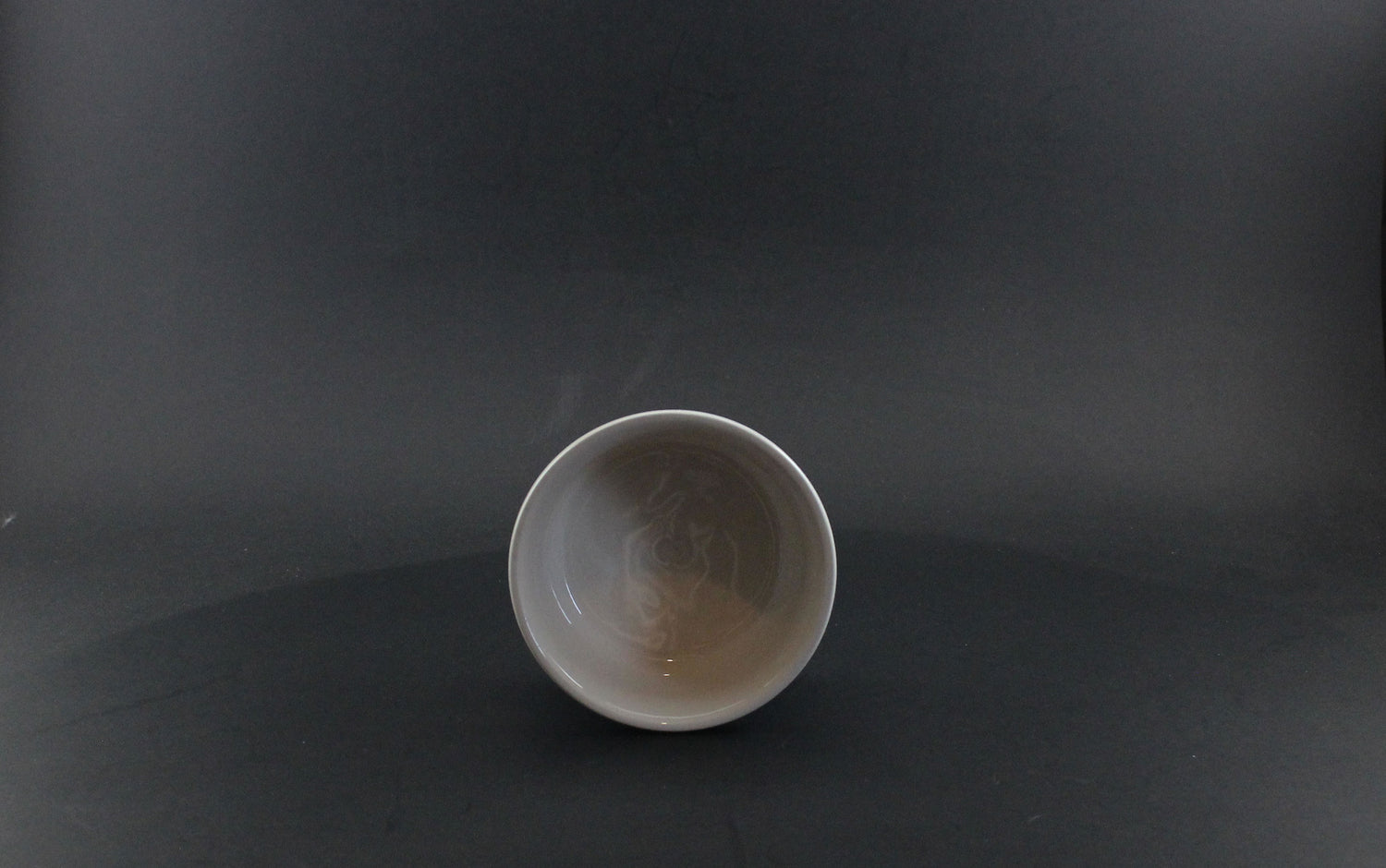 Ceramic bowl on a dark gray background