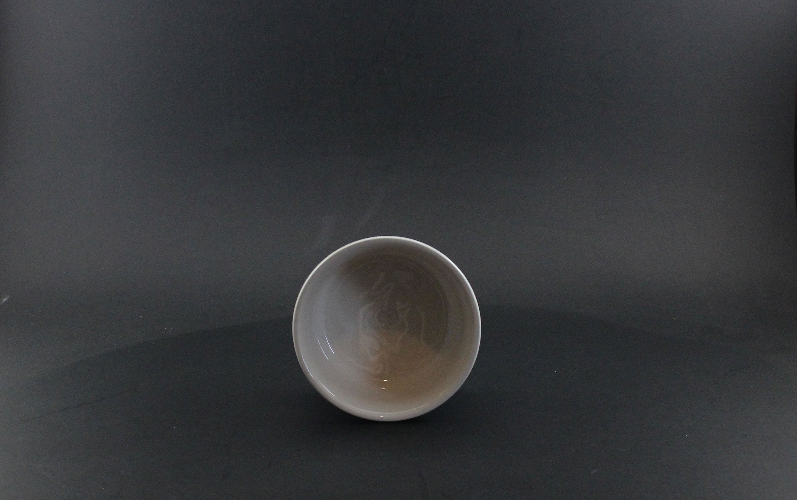 Ceramic bowl on a dark gray background