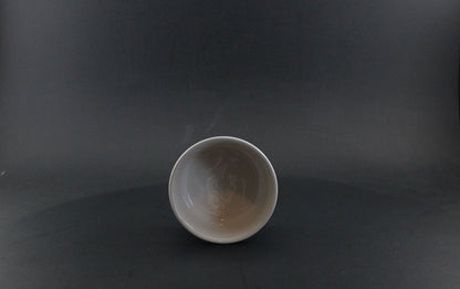 Ceramic bowl on a dark gray background