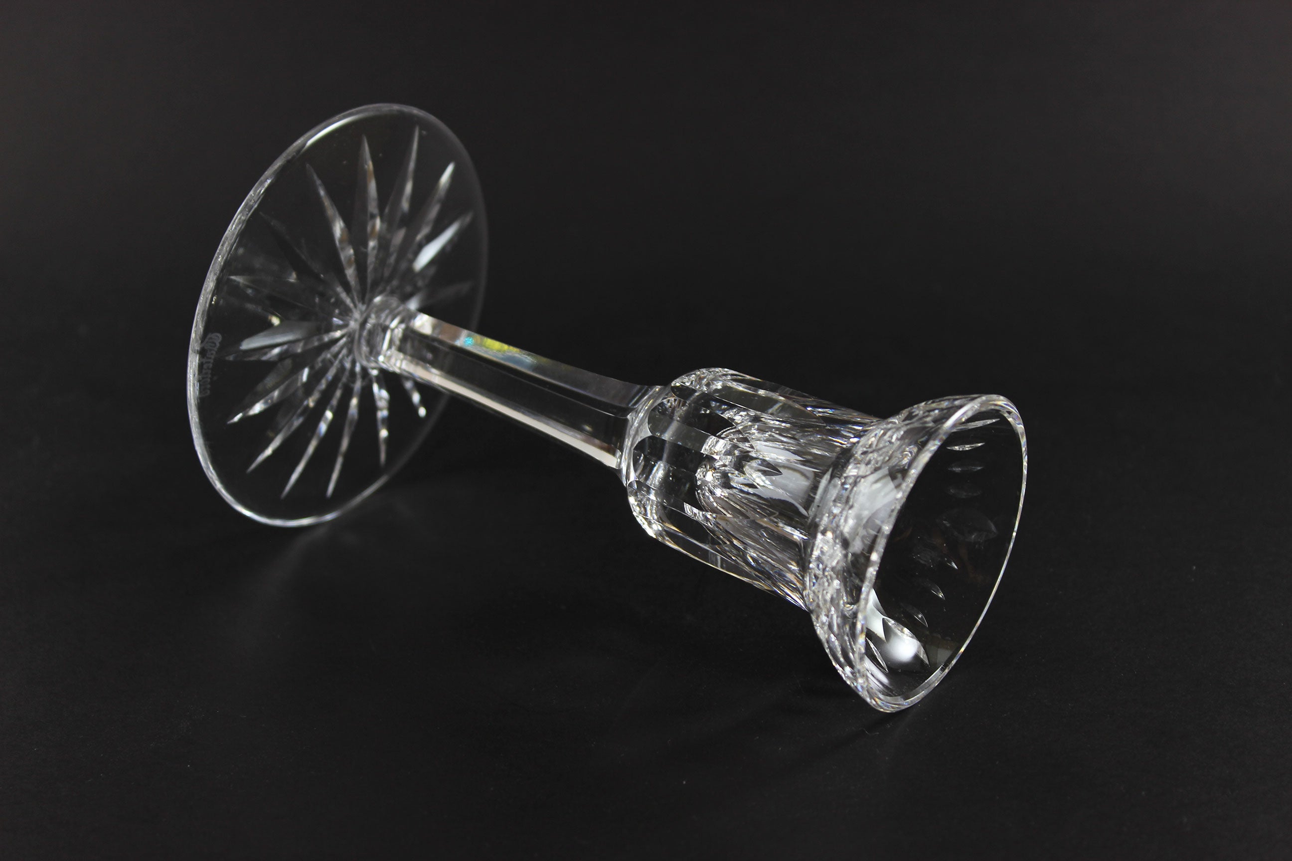 Clear crystal candlestick on a black background