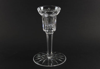 Clear crystal candlestick on a black background