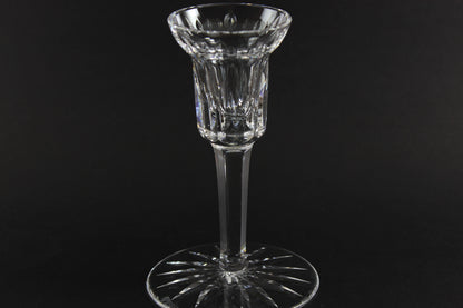 Clear crystal candlestick on a black background