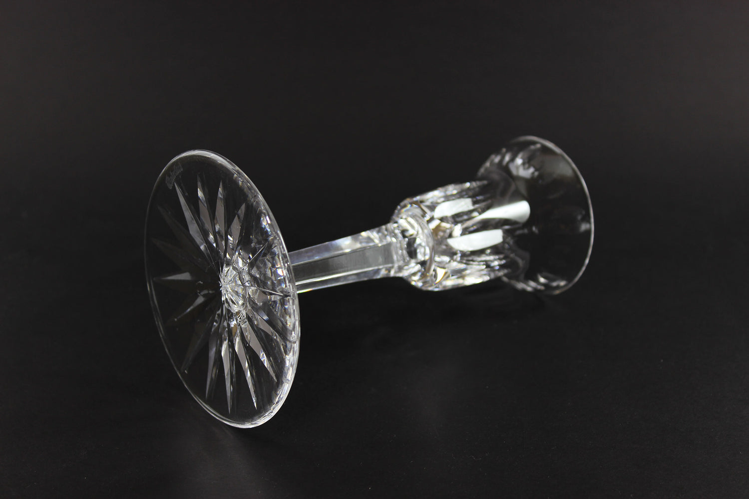 Clear crystal candlestick on a black background