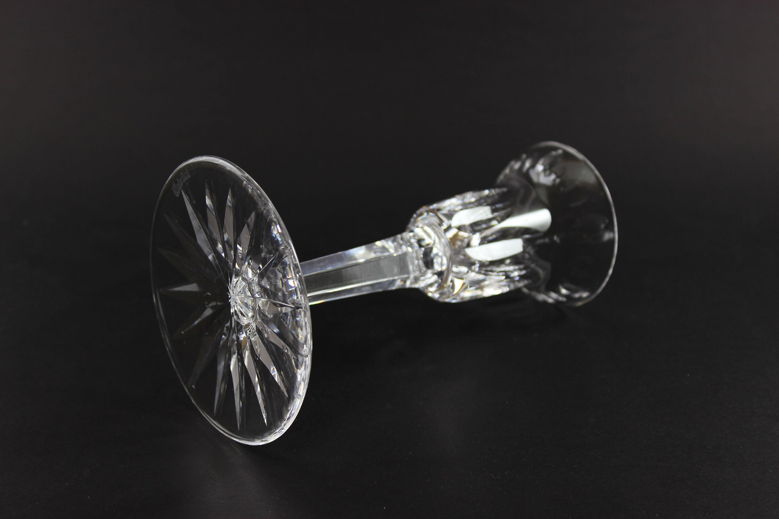 Clear crystal candlestick on a black background