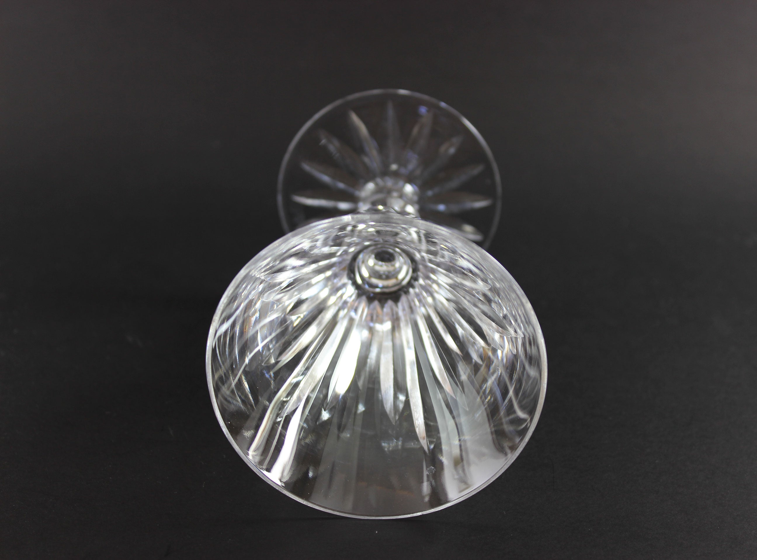 Cut ut crystal  goblet with intricate designs on a black background