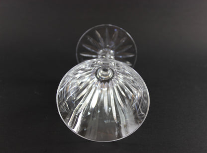 Cut ut crystal  goblet with intricate designs on a black background