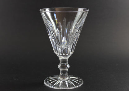 Cut crystal  goblet with intricate designs on a black background