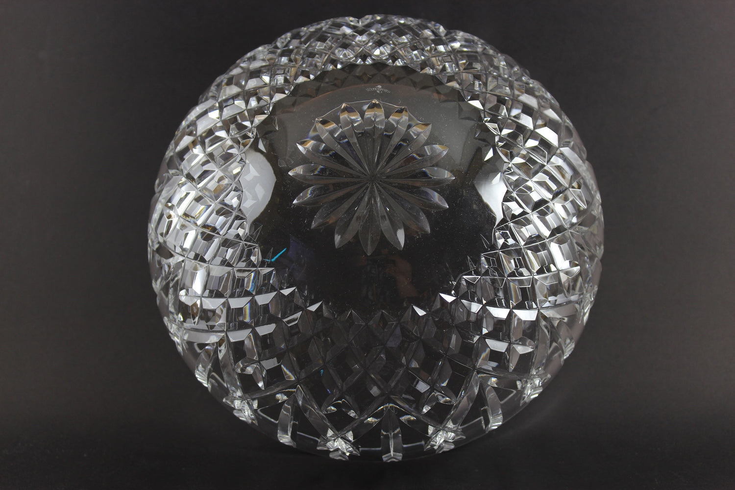 Waterford cut crystal bowl with intricate designs on a black background