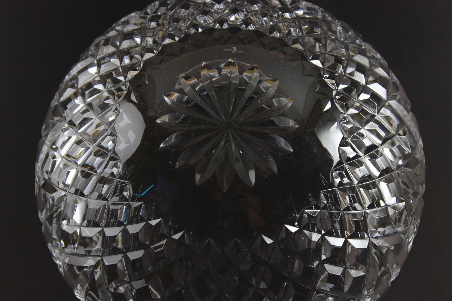 Waterford cut crystal bowl with intricate designs on a black background