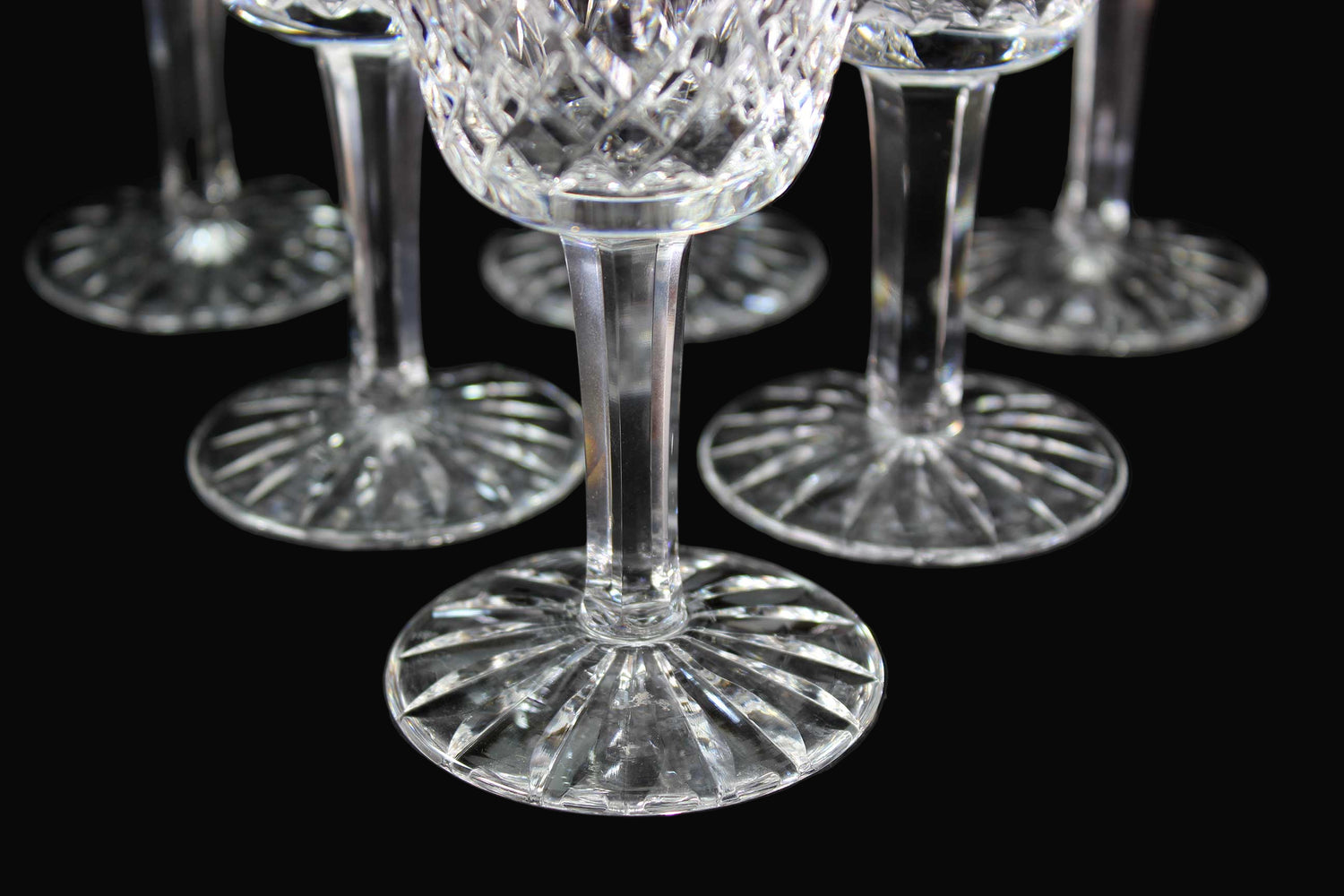 Set of crystal wine glasses on a dark surface