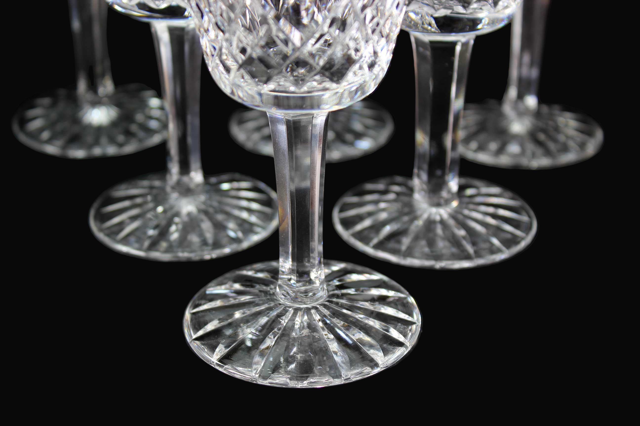 Set of crystal wine glasses on a dark surface