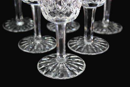 Set of crystal wine glasses on a dark surface