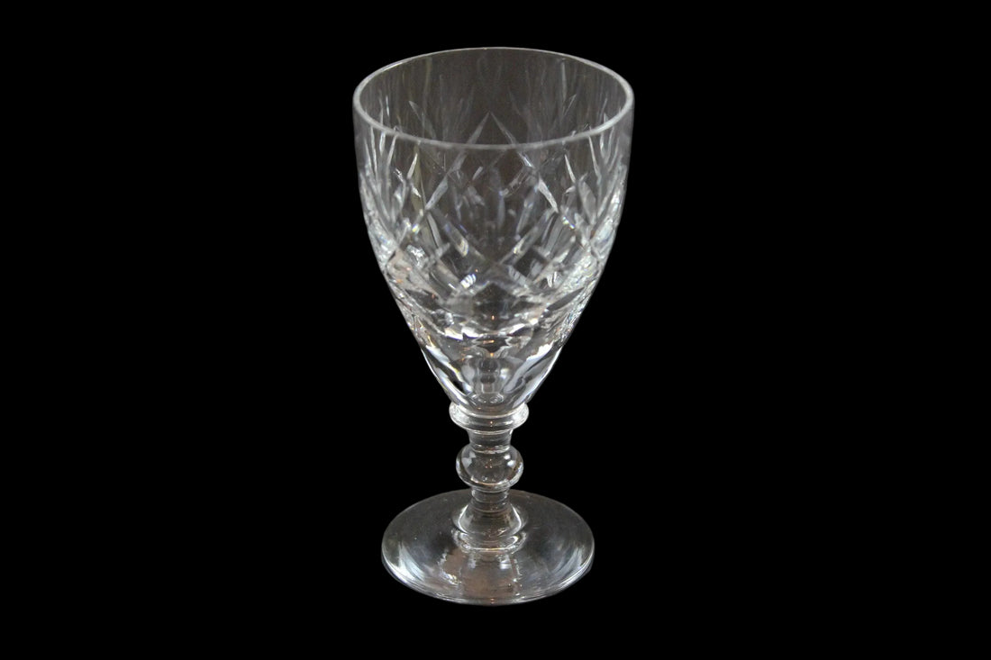 Set of six crystal sherry or port glasses on a dark background