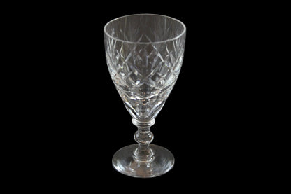 Set of six crystal sherry or port glasses on a dark background