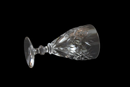 Set of six crystal sherry or port glasses on a dark background