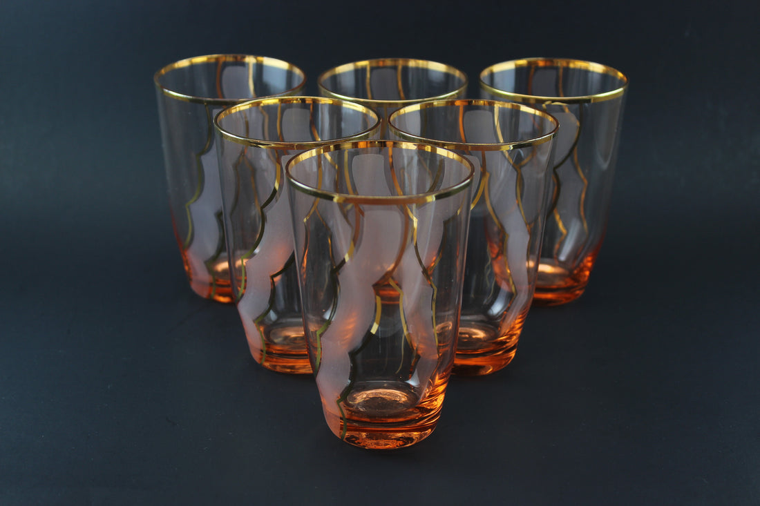 Pink crystal tumblers with gold accents